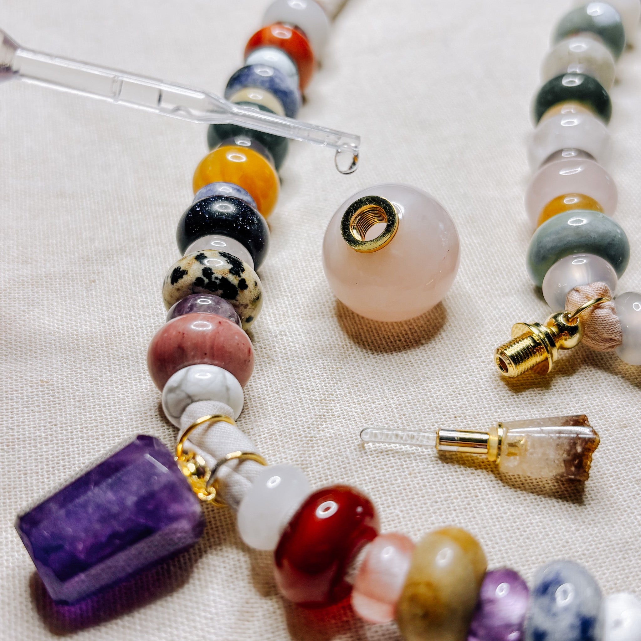 Gemstone beads and rose quartz vial on a Sunbleached Bandana **Choose Your Water Source**